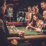 Upper class friends gambling in a casino
